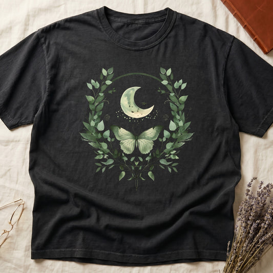 Black t-shirt with celestial moon, butterfly, and botanical wreath graphic.