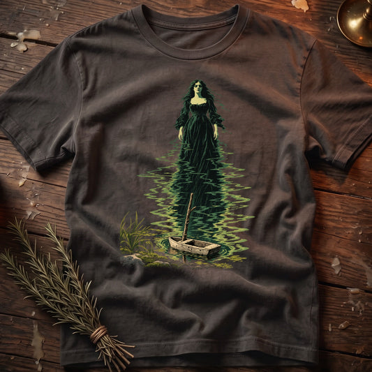 Dark t-shirt with graphic of a woman in a green dress in water with a rowboat.