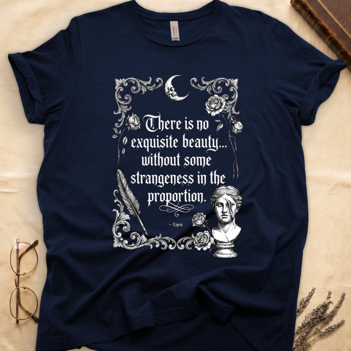 Navy t-shirt with "There is no exquisite beauty... without some strangeness in the proportion. - Ligeia" text and ornate art.