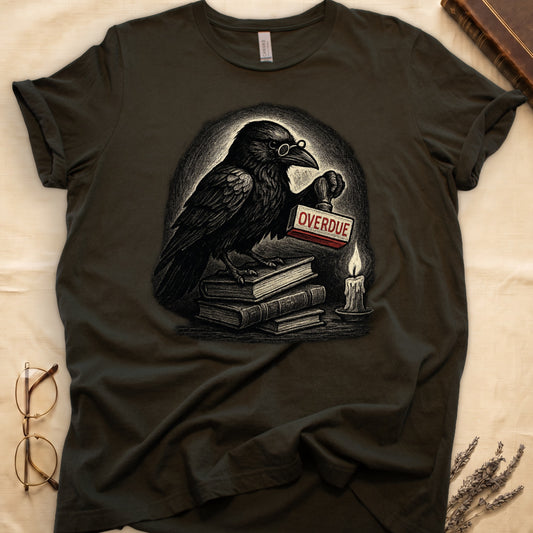 Military Green tee with bespectacled raven on stacked books, holding wooden "OVERDUE" stamp, lit candle beside, dawn glow behind.