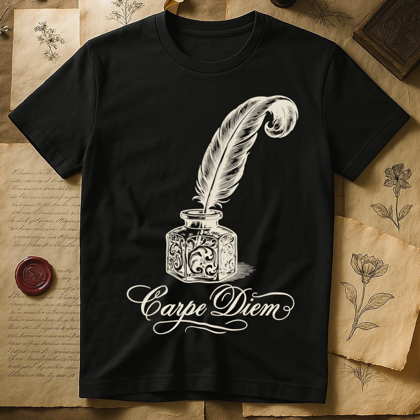 Black tee with ornate antique inkwell and quill pen in sepia linework, "Carpe Diem" in flowing cursive below.