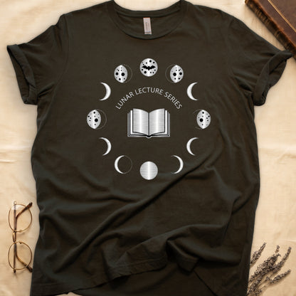 Military Green tee with open book at center, ring of cream moon phases around, curved "LUNAR LECTURE SERIES" double-arc above.