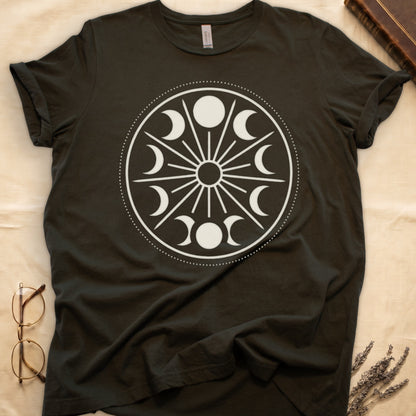 Military Green tee with cream lunar orrery wheel, dotted ring, radial sunburst, moon phases around perimeter, central star.
