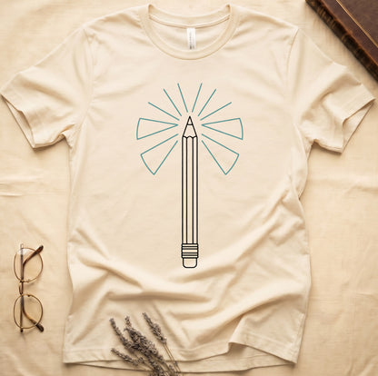Natural tee with single vertical graphite pencil in cream linework, fan of teal and grey rays radiating behind.