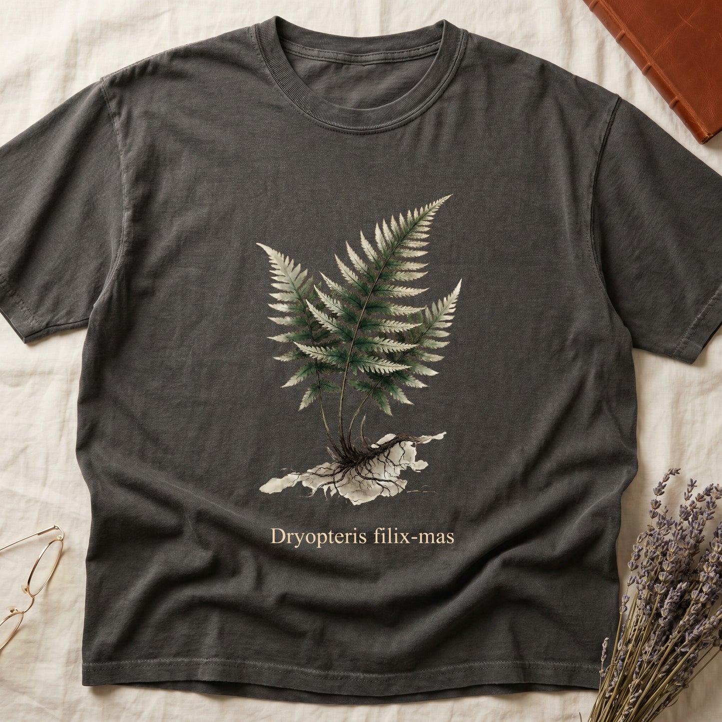 Pepper tee with Victorian fern illustration of Dryopteris filix-mas in greens with exposed root, italic Latin binomial below.