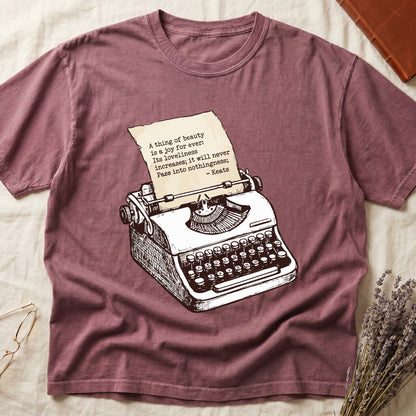 Dark Rose tee with vintage typewriter in cream linework, paper showing "A thing of beauty is a joy for ever" by Keats.