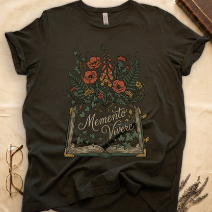 Military Green tee with open book and botanical illustration, red poppies, golden foxglove, ferns and ivy spilling from the pages.