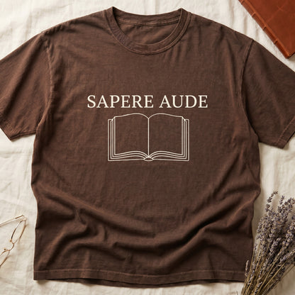 Espresso tee with "SAPERE AUDE" in serif capitals above a minimalist open book in cream linework.