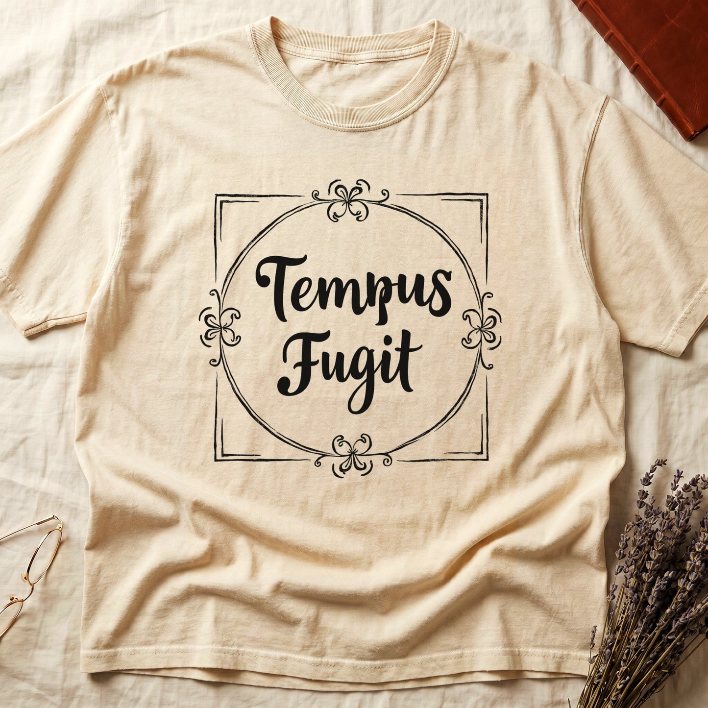 Ivory tee with cream "Tempus Fugit" script inside square filigree frame, decorative corner flourishes, classical typography.