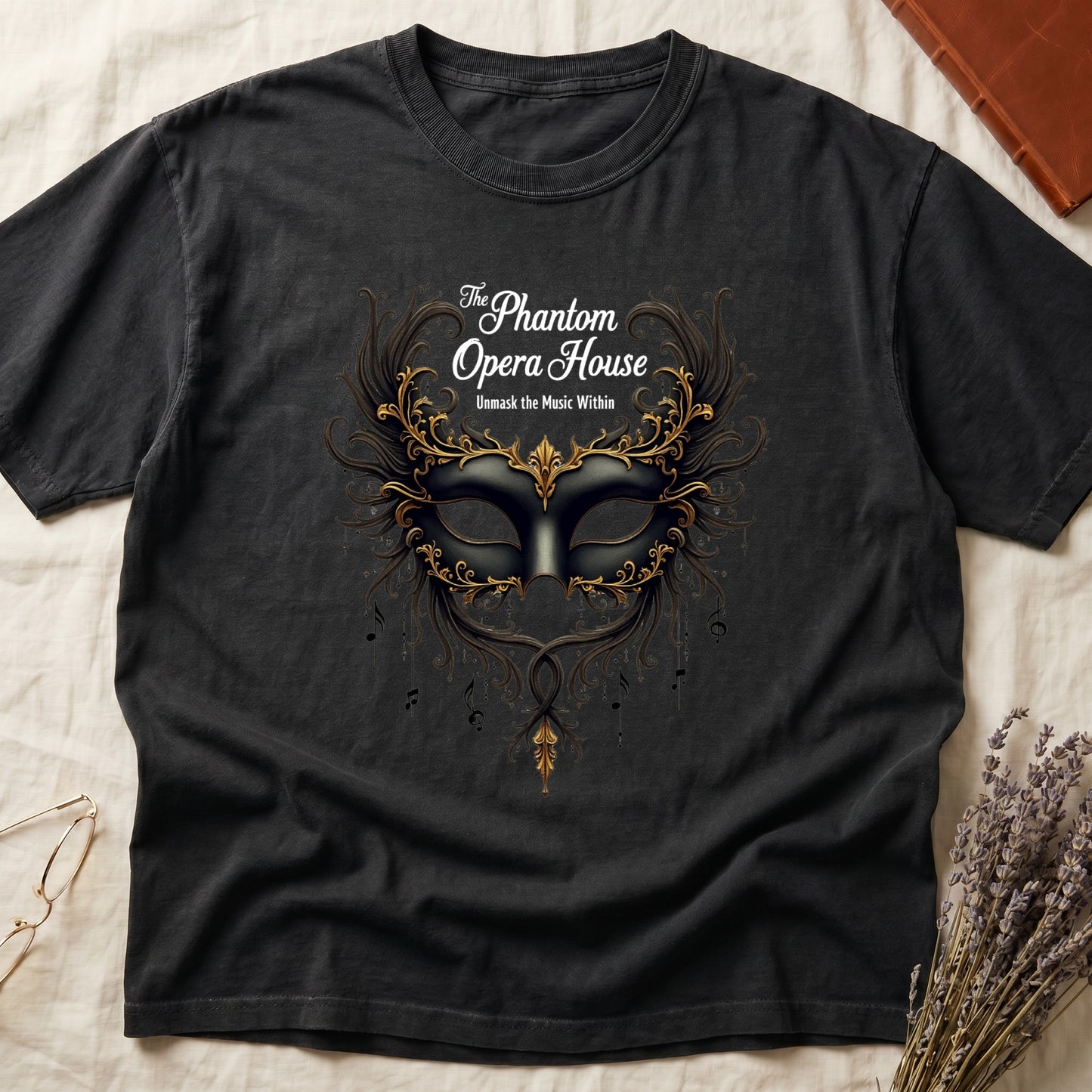 Black tee with gold-and-black masquerade mask, scrollwork wings, "The Phantom Opera House," "Unmask the Music Within."