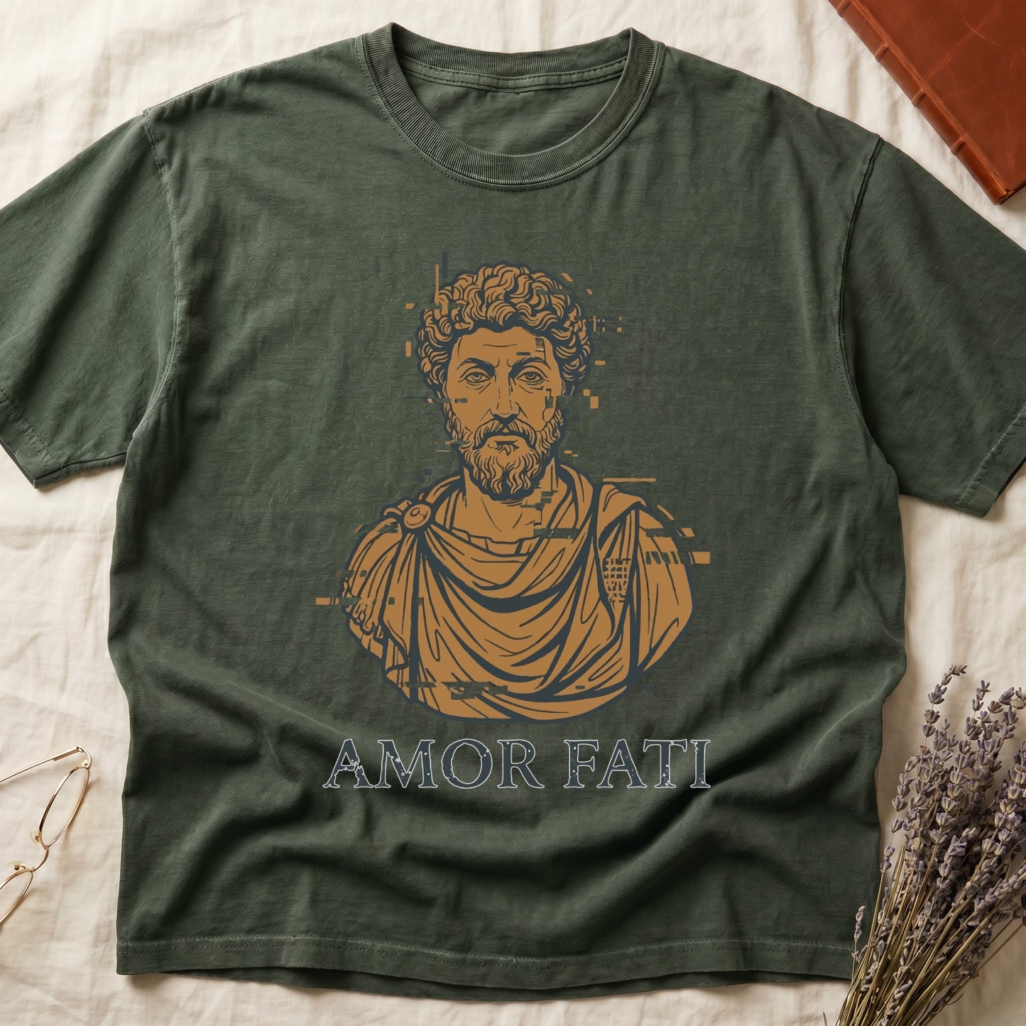 Green tee with bearded Stoic bust portrait in copper and slate, "AMOR FATI" in distressed serif capitals below.