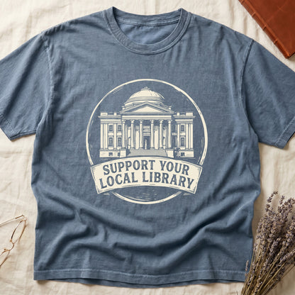 Blue Jean tee with circular cream badge of a classical library building, "SUPPORT YOUR LOCAL LIBRARY" on a banner below.