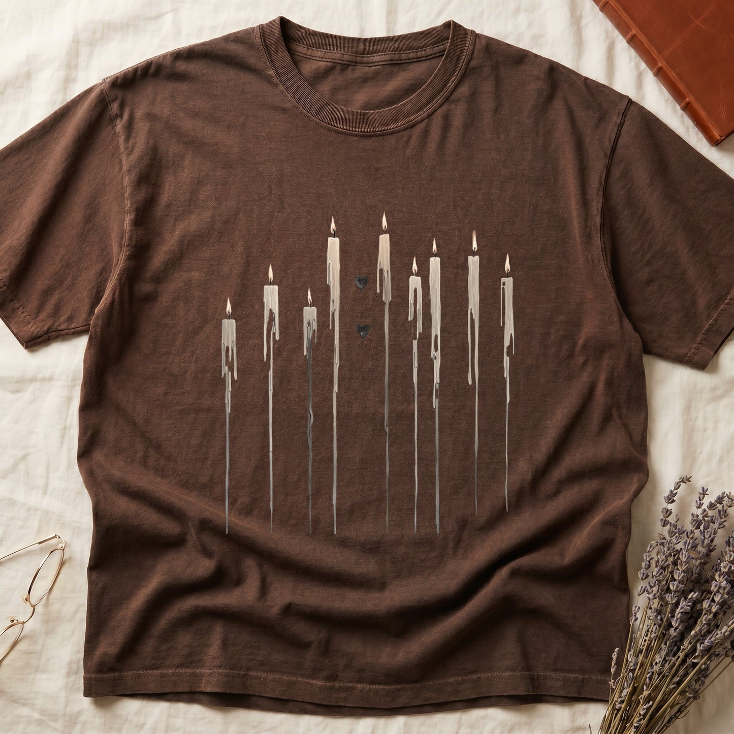 Brown t-shirt with dripping candles and two small black hearts graphic.