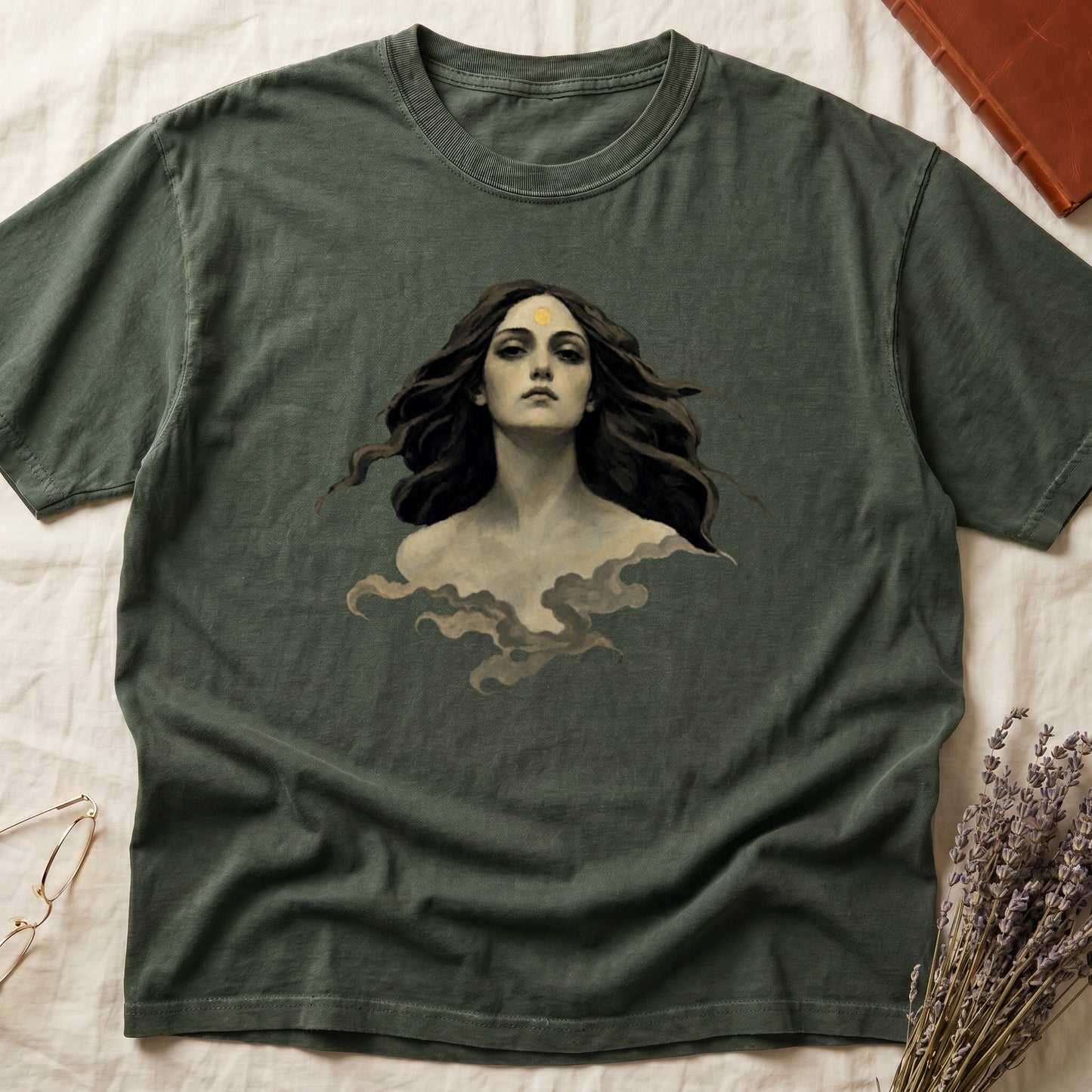 Dark green t-shirt with a portrait of a woman with flowing hair emerging from clouds.
