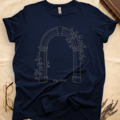 Navy tee with Gothic stone archway in cream linework, ivy climbing the columns, "Est. 1892" inscribed at the base.