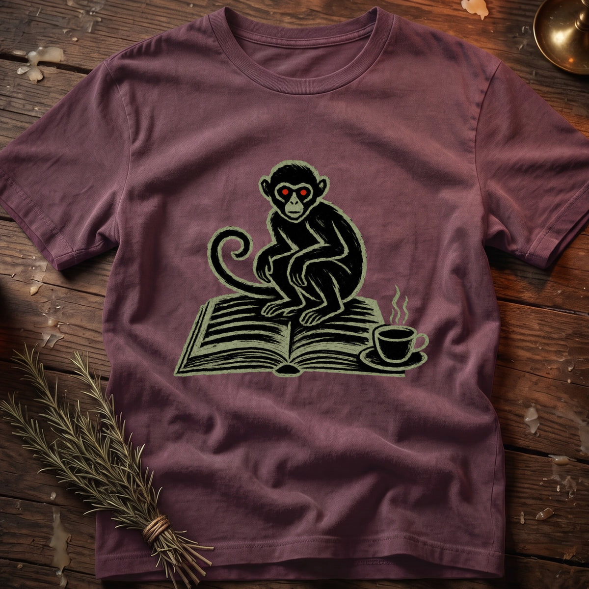 Monkey with red eyes sits on an open book next to a steaming coffee cup.