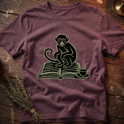 Monkey with red eyes sits on an open book next to a steaming coffee cup.