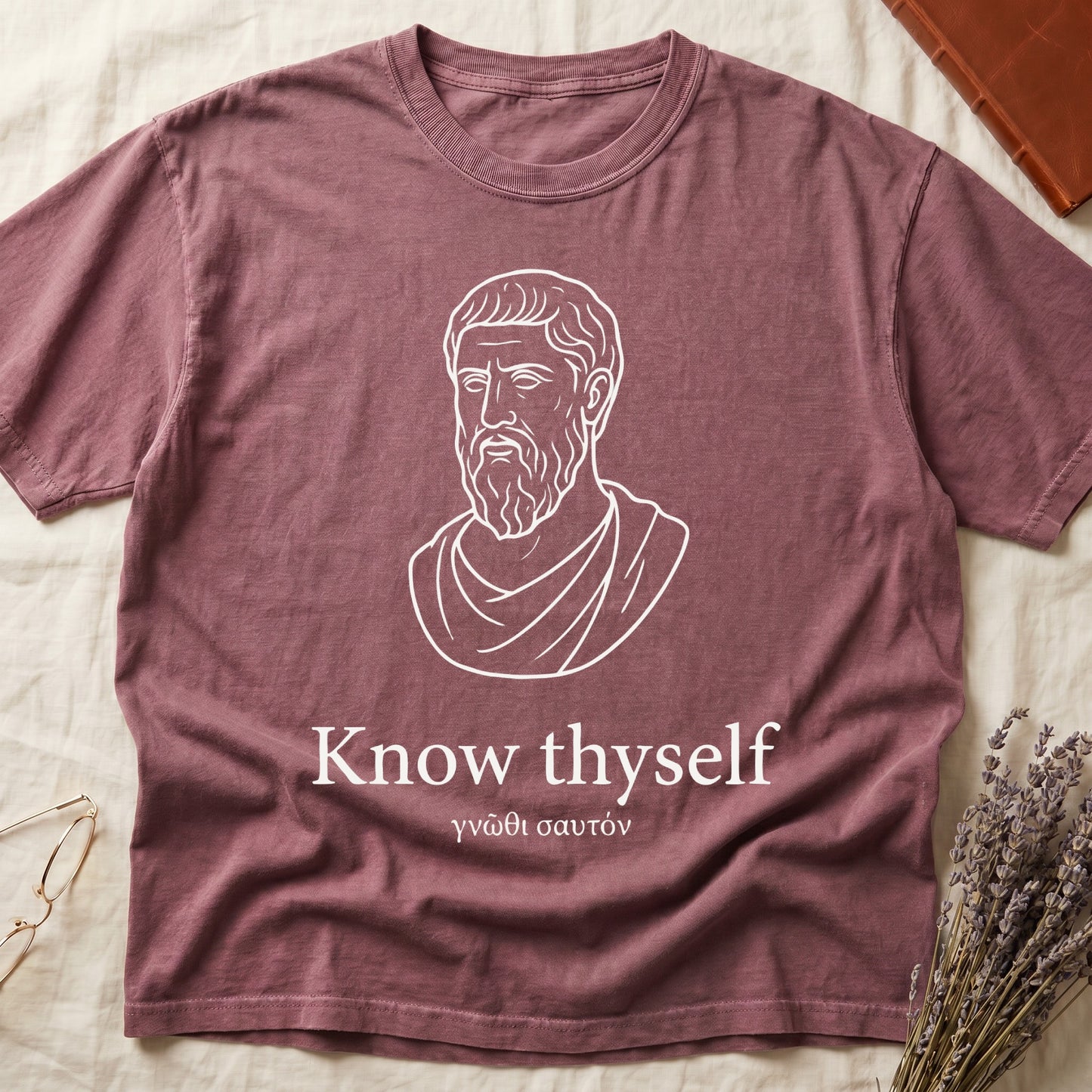 Dark Rose tee with classical Greek philosopher bust in white linework, "Know thyself" in cream serif below.