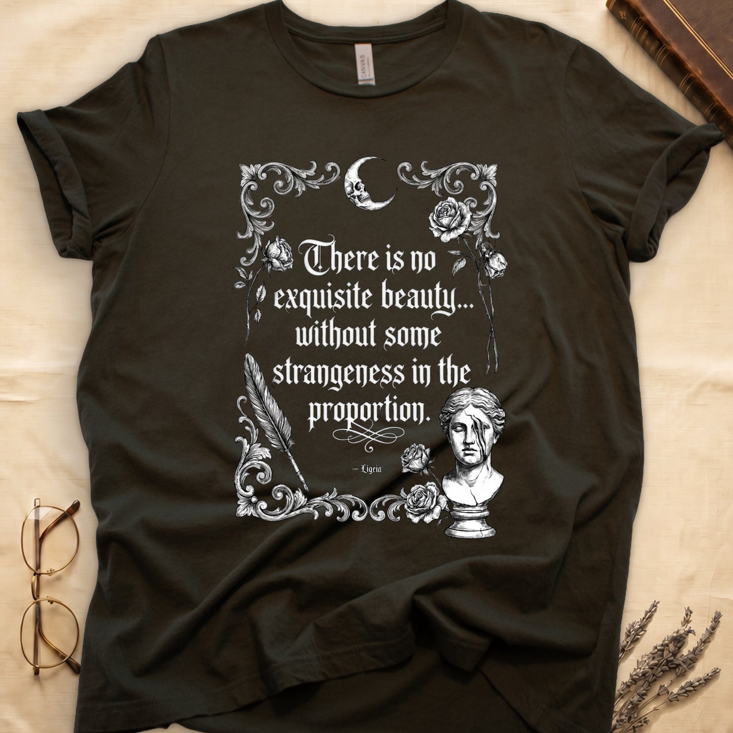 Dark t-shirt with white gothic text and floral skull moon bust design.