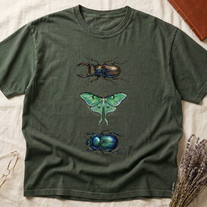 Black tee with three-panel Green-history plate: stag beetle, luna moth, scarab beetle in ink on yellow ground.