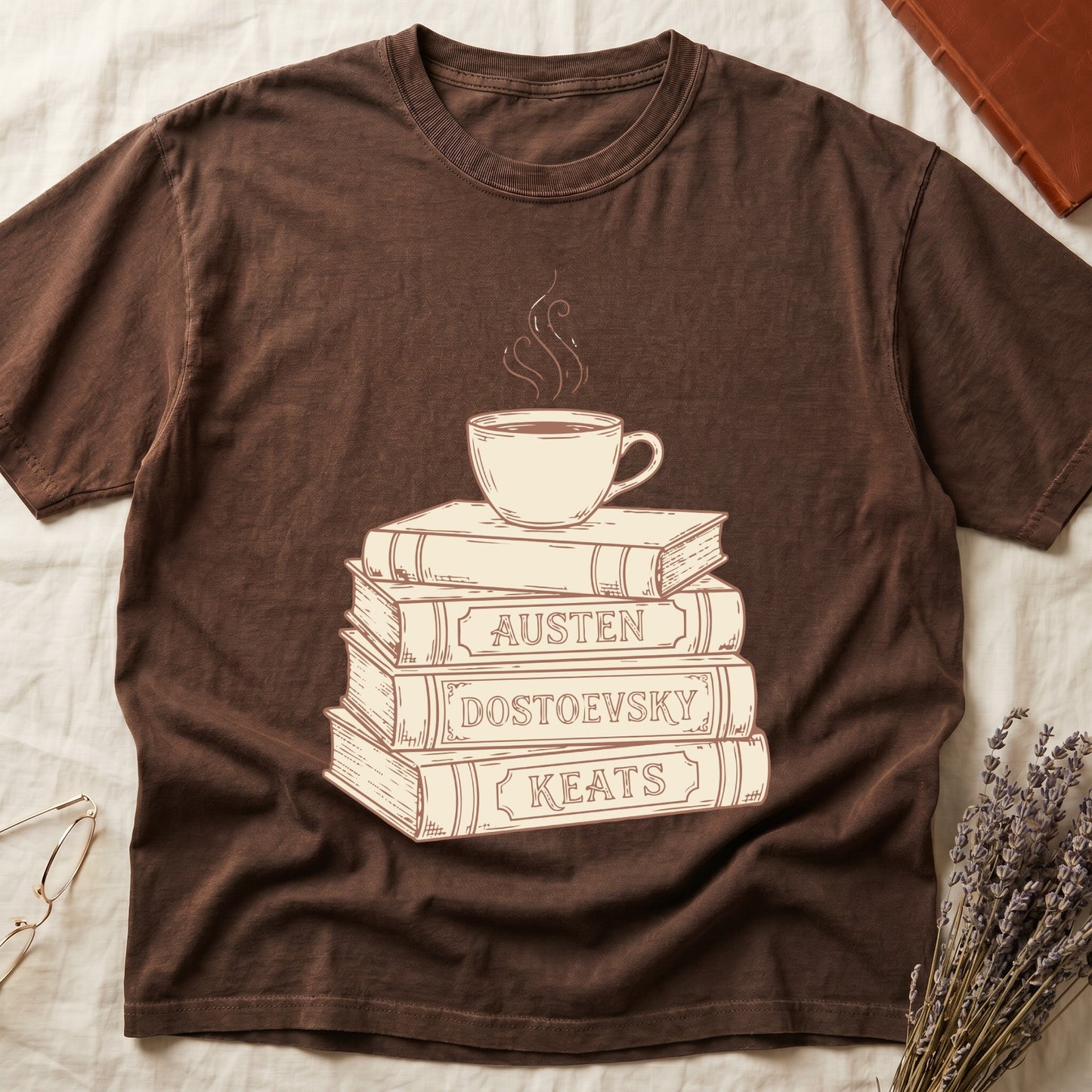 Espresso tee with stack of vintage books labeled "AUSTEN," "DOSTOEVSKY," "KEATS" topped with a steaming coffee cup.