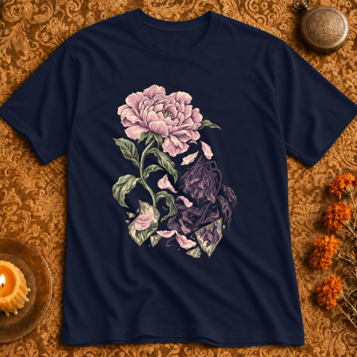 Dark blue t-shirt with a pink peony blooming and wilting with shattered glass elements.