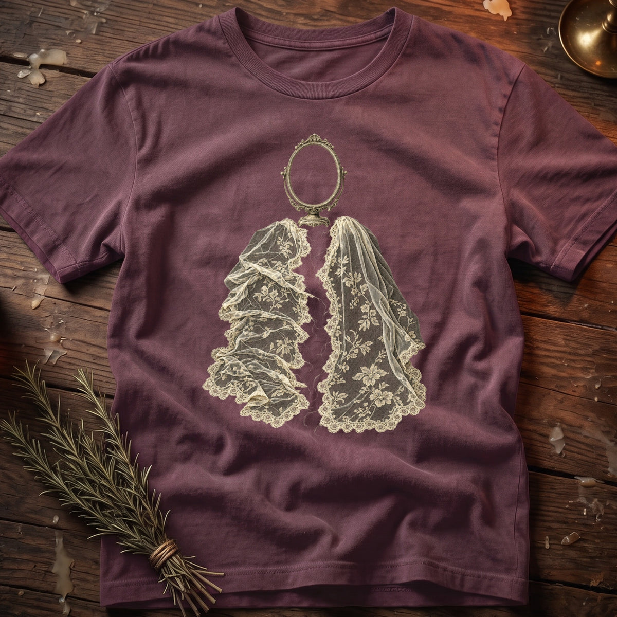 Maroon t-shirt with an oval mirror and draped lace veil graphic.
