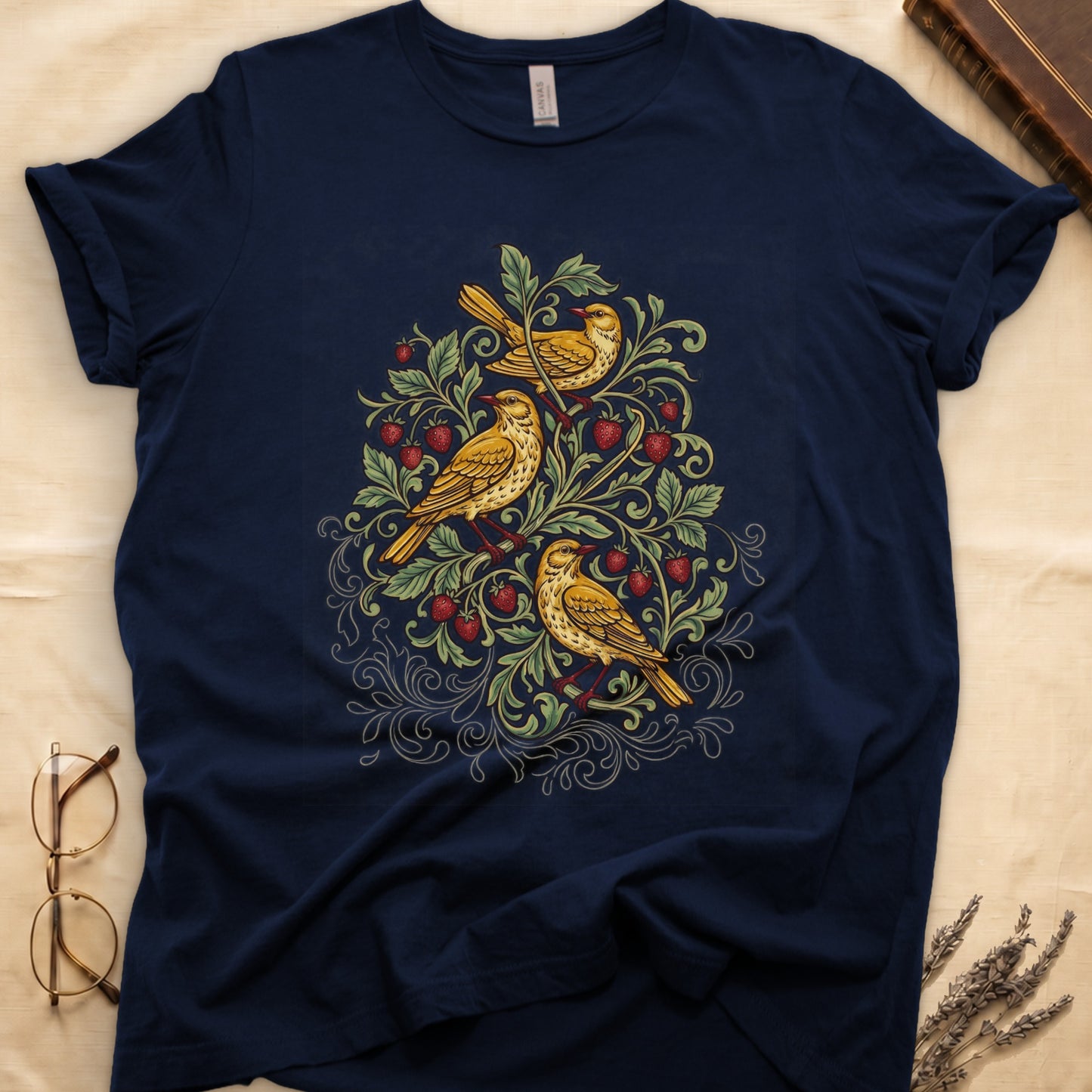 Navy tee with three yellow songbirds perched among strawberry vines and green leaves, William Morris pattern style.