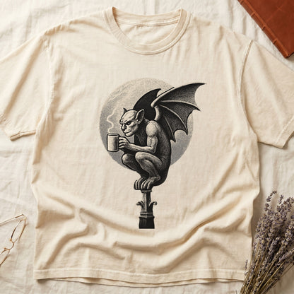 Ivory tee with gargoyle on stone pinnacle holding coffee mug, cream-parchment full moon behind, engraving style.