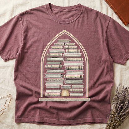 Dark Rose tee with gothic arch frame, columns of leather-bound books inside, sunburst medallion at base, cream engraved linework.