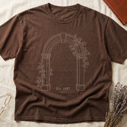 Espresso tee with Gothic stone archway in cream linework, ivy climbing the columns, "Est. 1892" inscribed at the base.