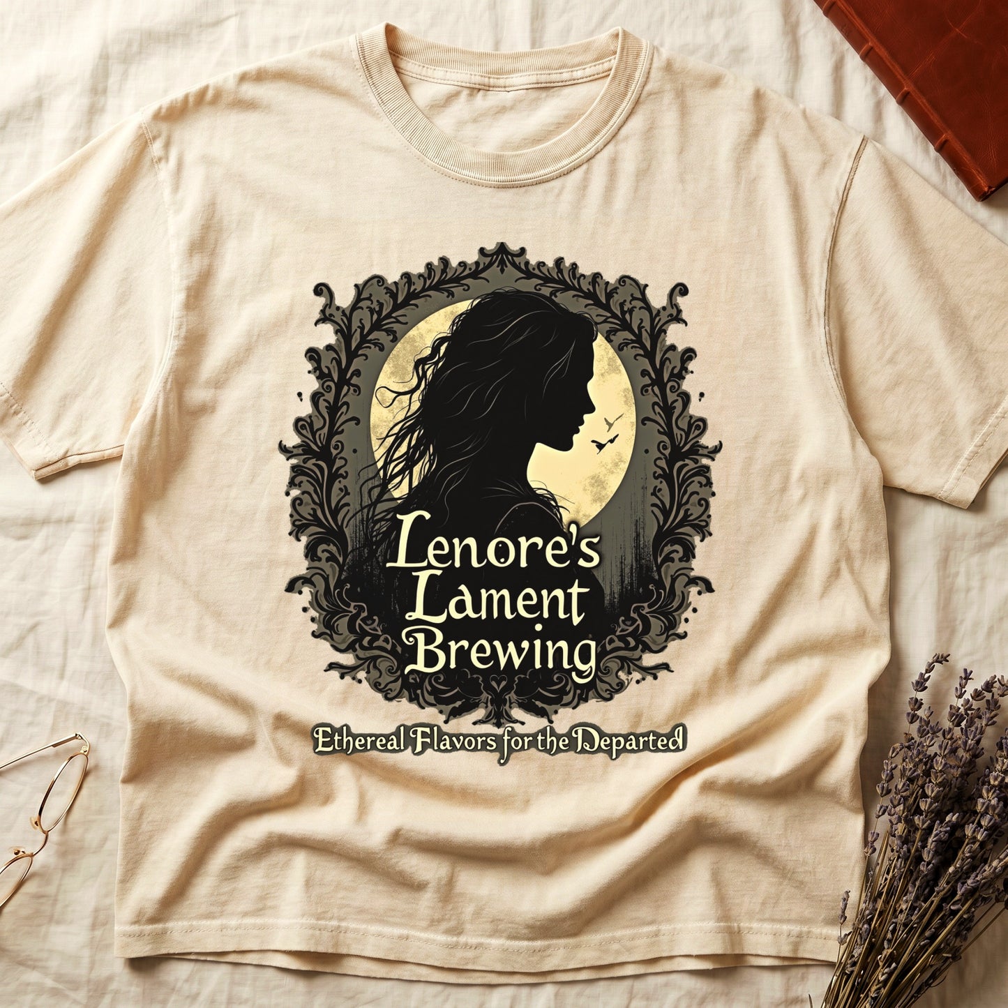 Ivory tee with sage label, Lenore silhouette and moon, "Lenore's Lament Brewing," "Ethereal Flavors for the Departed."