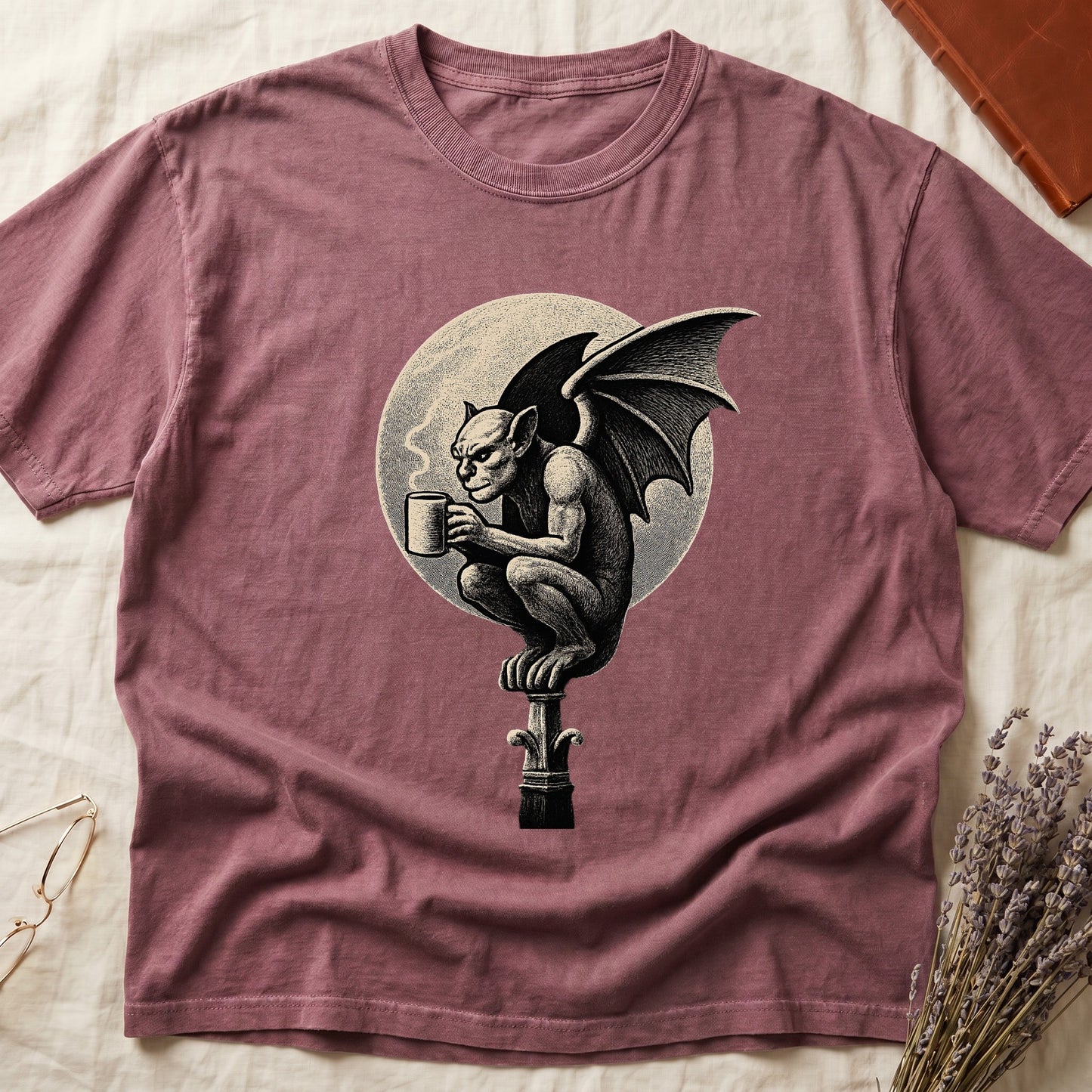 Dark Rose tee with gargoyle on stone pinnacle holding coffee mug, cream-parchment full moon behind, engraving style.