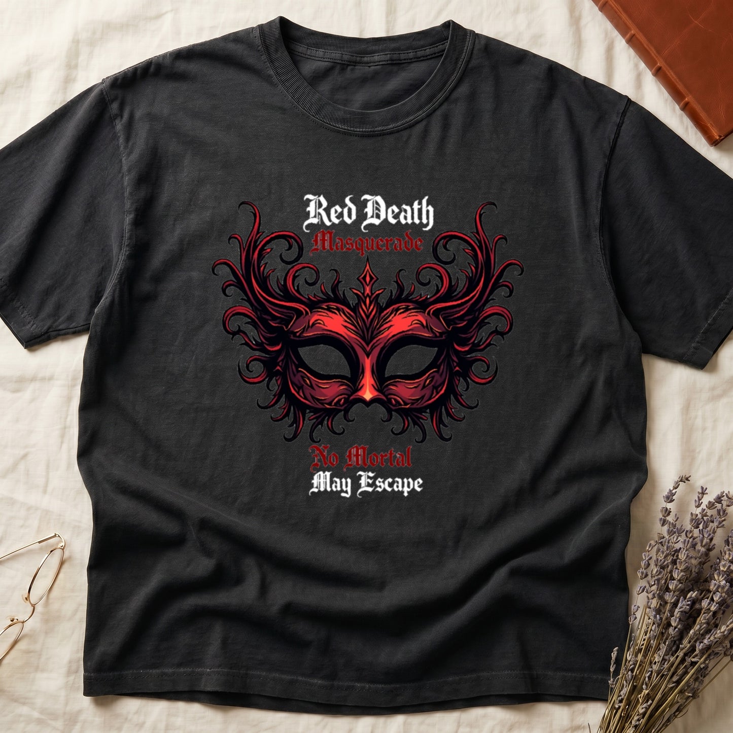 Black tee with ornate red masquerade mask, flame scrollwork, "Red Death Masquerade" top, "No Mortal May Escape" below.