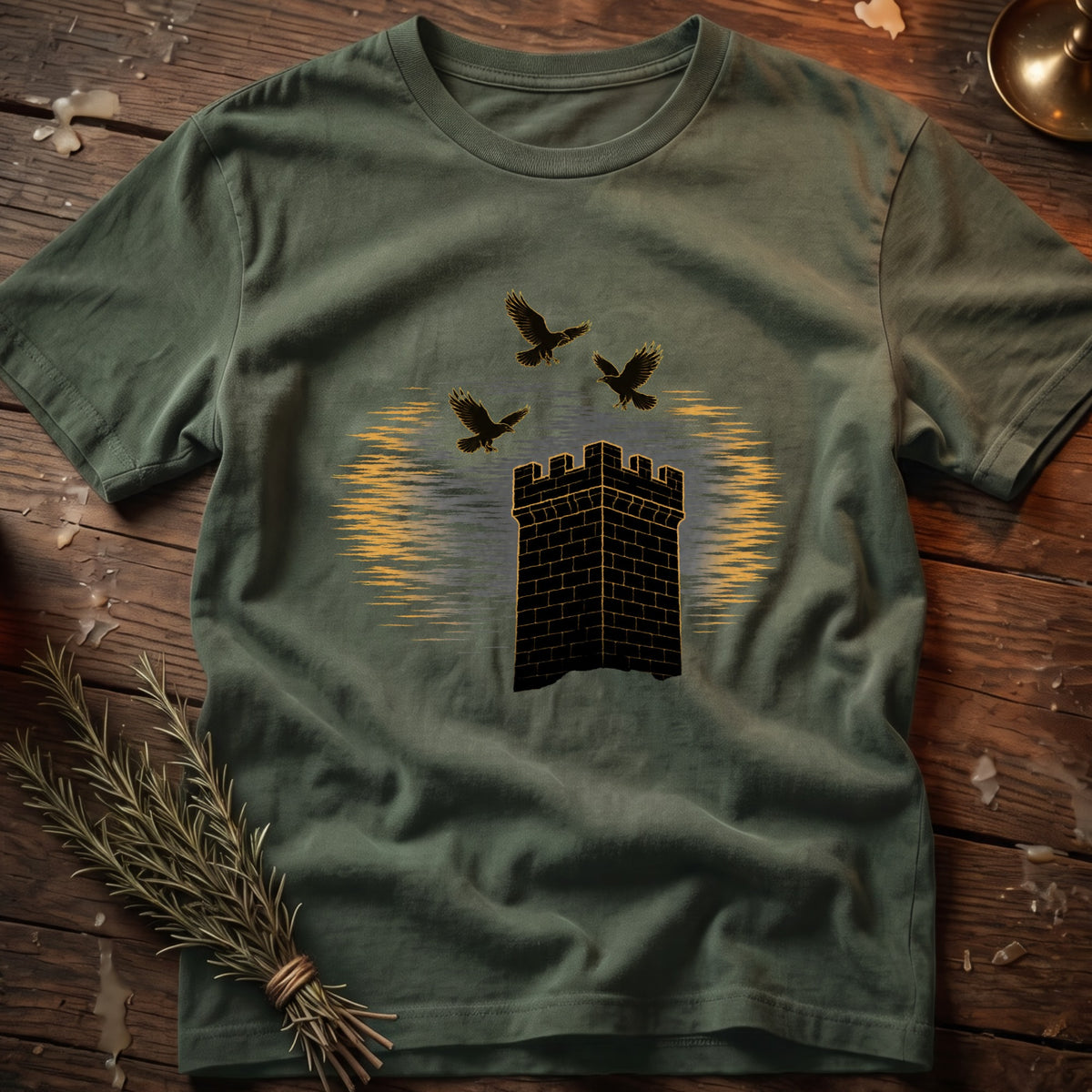Green t-shirt with black castle and three black birds graphic.