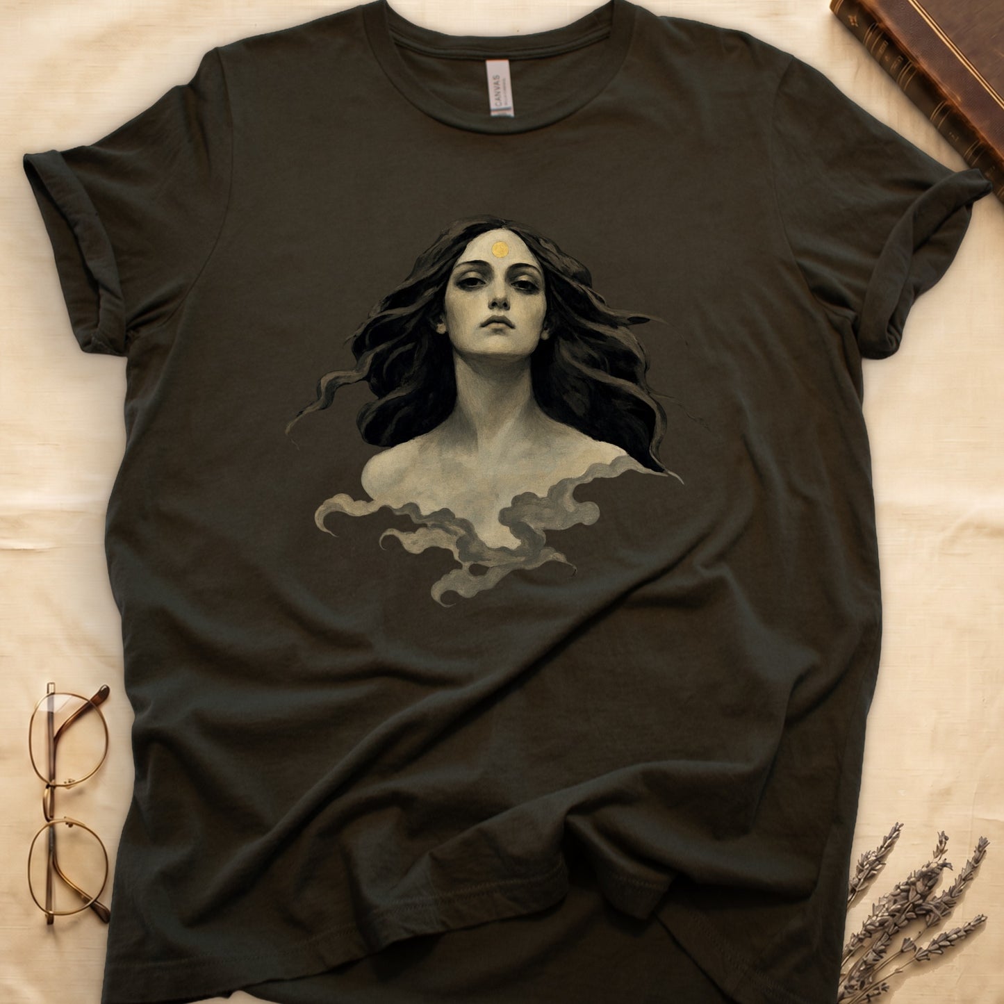 Dark t-shirt with ethereal portrait of a woman with flowing hair and a golden sun on forehead.