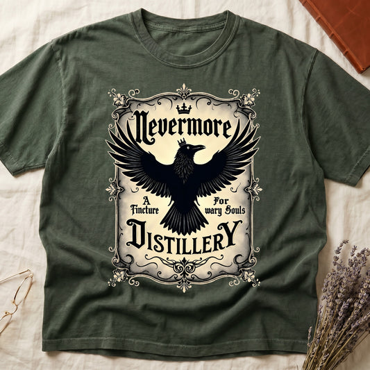 Green tee with antique label, crowned raven, blackletter "Nevermore" top, "A Tincture For wary Souls," "DISTILLERY" bottom.