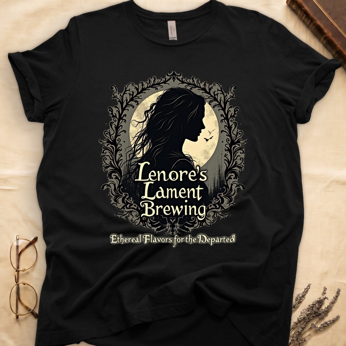 Black tee with sage label, Lenore silhouette and moon, "Lenore's Lament Brewing," "Ethereal Flavors for the Departed."