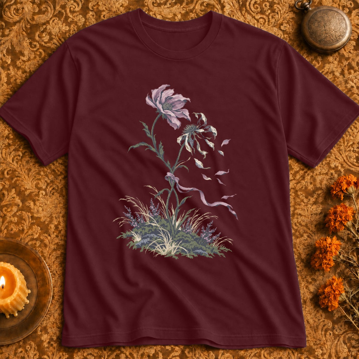 Maroon t-shirt with a faded floral illustration and ribbon design.