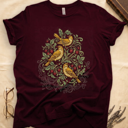 Maroon tee with three yellow songbirds perched among strawberry vines and green leaves, William Morris pattern style.