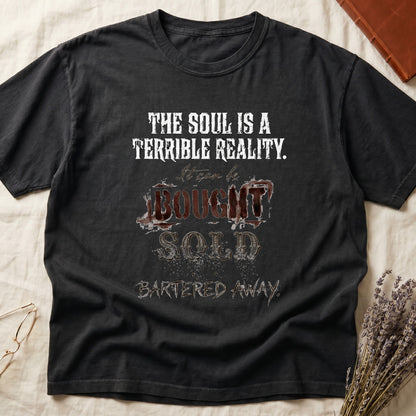 Black tee with distressed western type, "THE SOUL IS A TERRIBLE REALITY. It can be BOUGHT SOLD BARTERED AWAY."