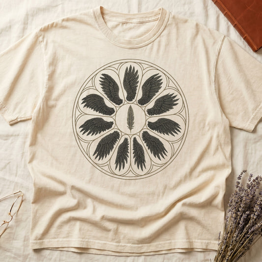 Ivory tee with sepia rose-window of eight feathered wings around central feather, engraved linework on parchment ground.