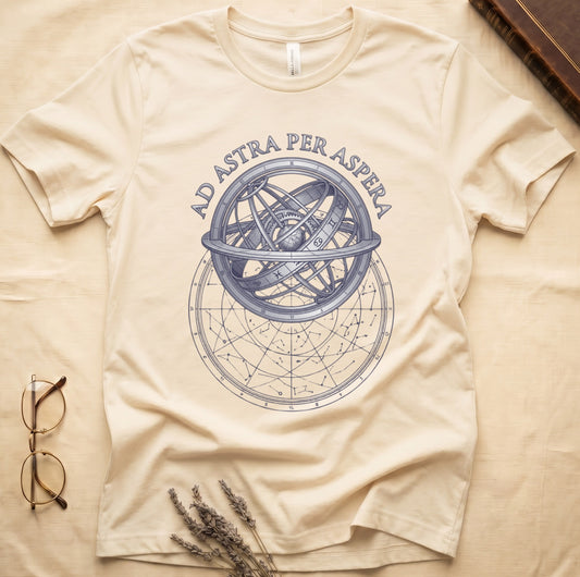 Natural tee with engraved armillary sphere, "AD ASTRA PER ASPERA" in serif capitals, zodiac symbols, classical astronomy.