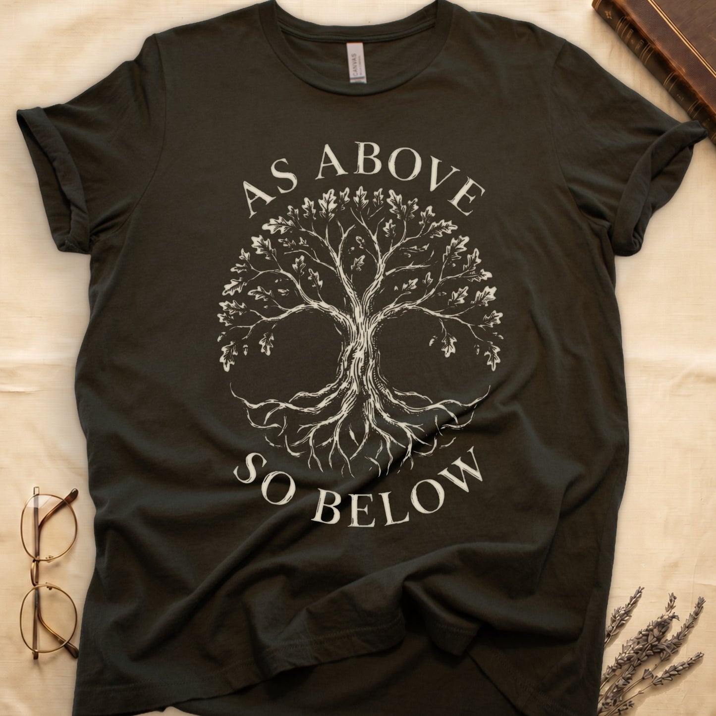 Military Green tee with Tree of Life in cream linework, mirrored canopy and roots, "AS ABOVE" and "SO BELOW" in serif arcs.