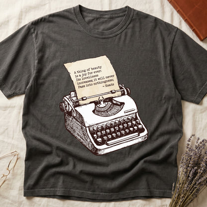 Pepper tee with vintage typewriter in cream linework, paper showing "A thing of beauty is a joy for ever" by Keats.