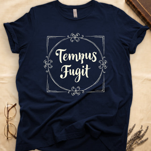 Navy tee with cream "Tempus Fugit" script inside square filigree frame, decorative corner flourishes, classical typography.