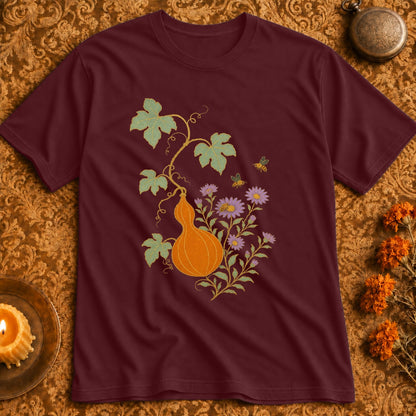 Maroon t-shirt with a gourd, flowers, and bees design.