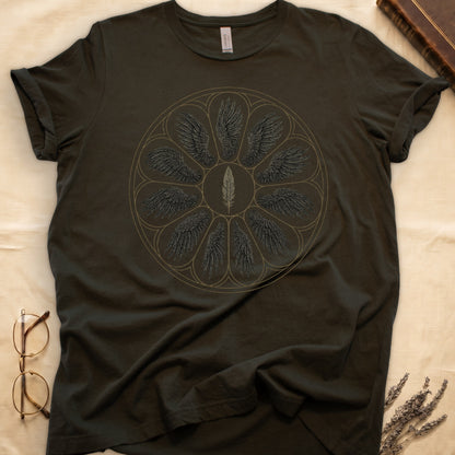 Military Green tee with sepia rose-window of eight feathered wings around central feather, engraved linework on parchment ground.