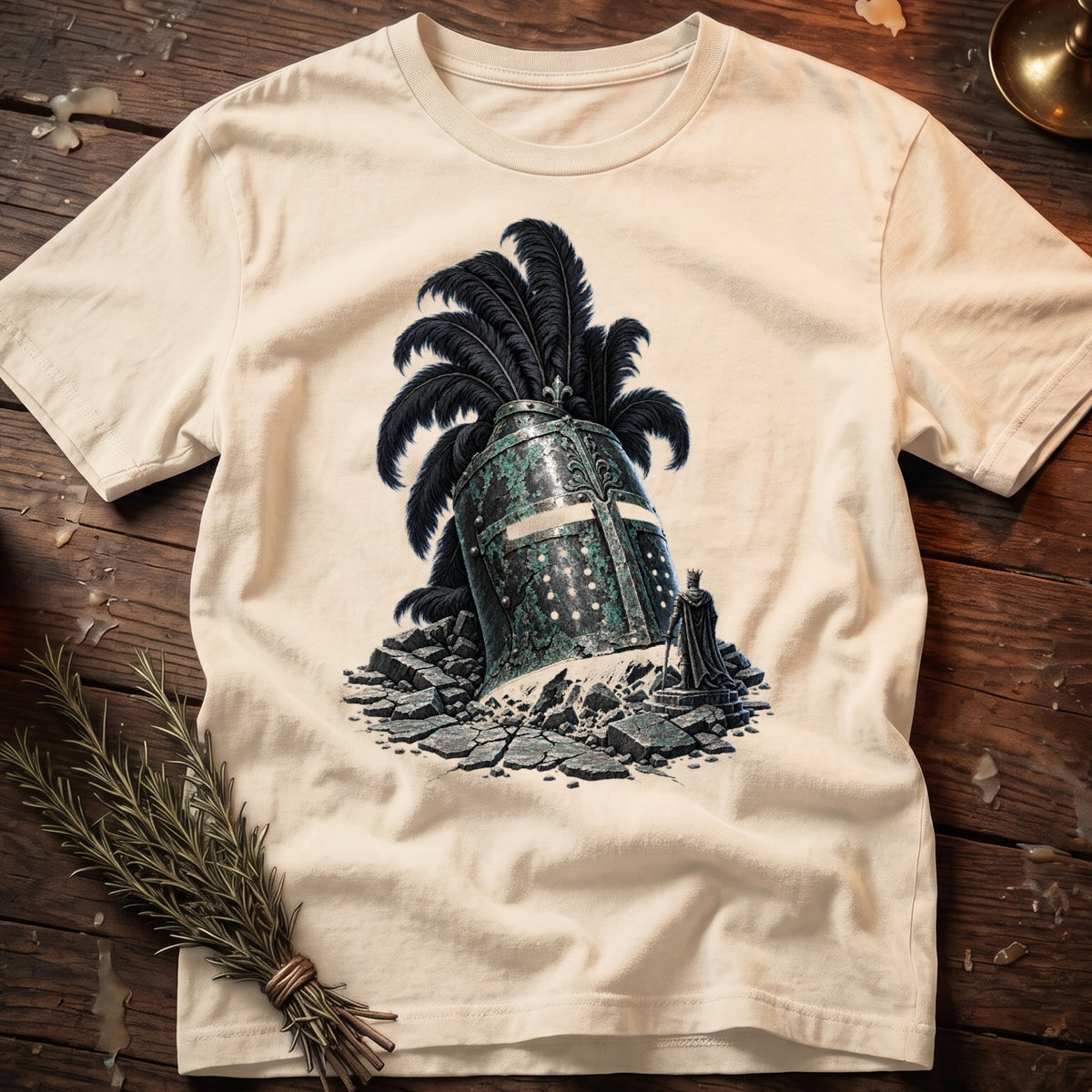 Cracked knight's helmet with black plume, cracked ground, and king statue on t-shirt.
