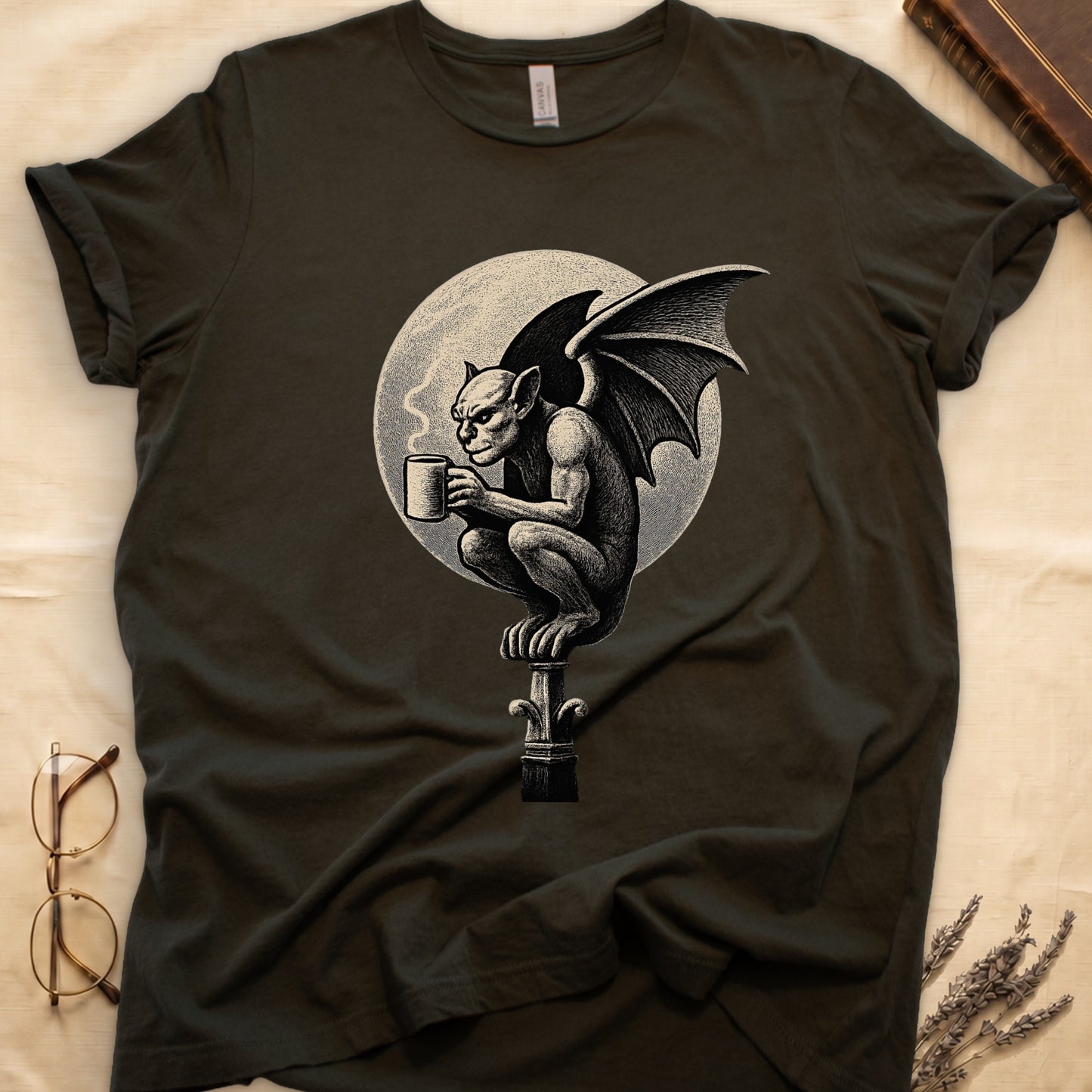 Military Green tee with gargoyle on stone pinnacle holding coffee mug, cream-parchment full moon behind, engraving style.
